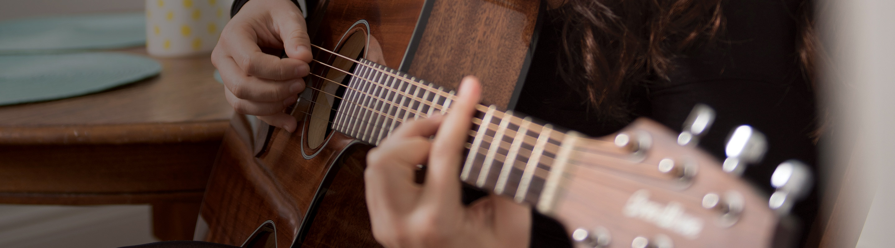 student playing guitar