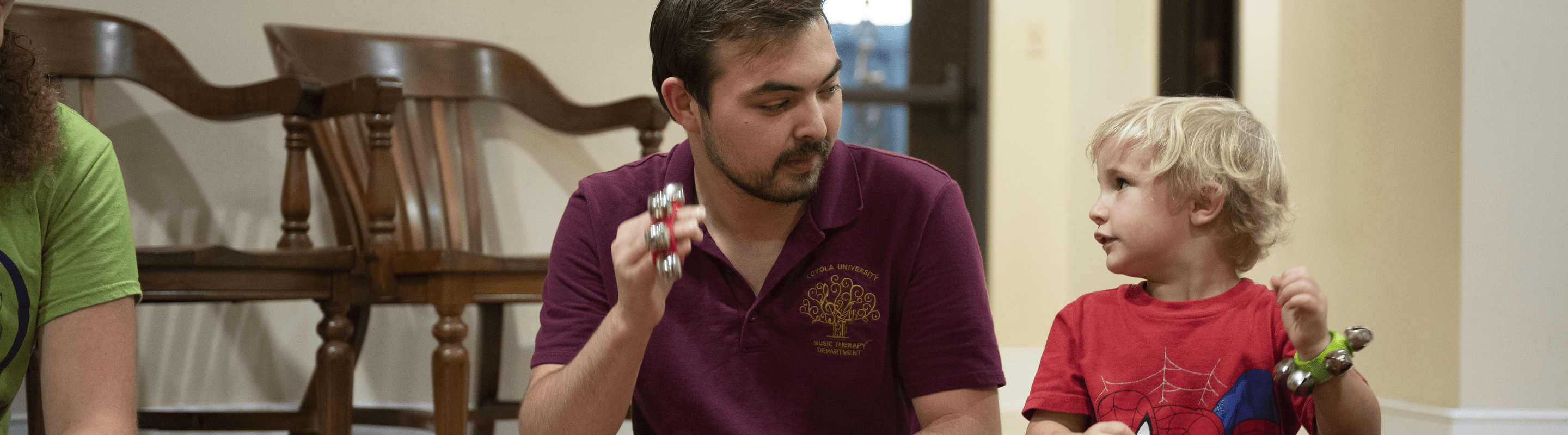 online master of music therapy student making music with a patient