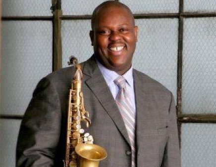 Wessell Anderson with a Saxophone