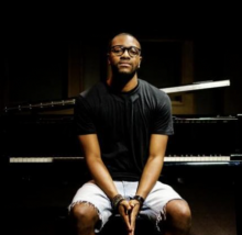 black tshirt, man-glasses, jean shorts